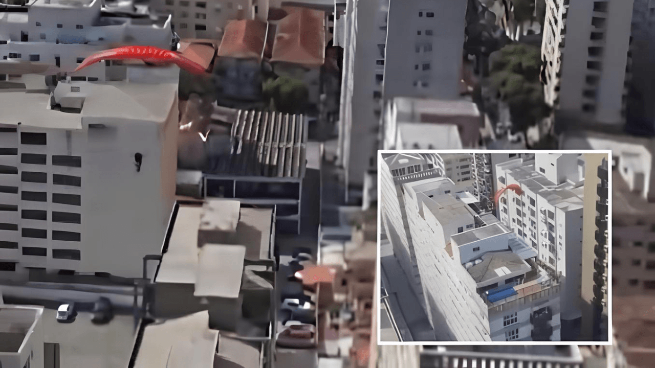 Mulher perde controle de parapente e fica pendurada em prédio no litoral de São Paulo