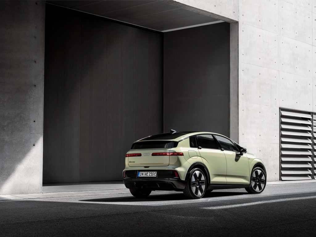 Colour: pistachio green, outdoor static shot, exterior, rear three-quarter view